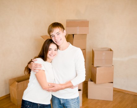 Small removals van and packed boxes in Cubitt Town