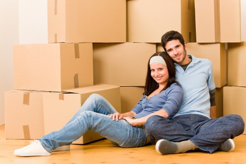 Professional movers handling furniture during a Cubitttown flat relocation